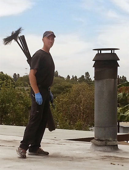 Chimney sweep on roof