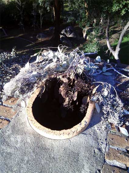 This is the result of a chimney fire in Coronado Another Chimney with Leaf Blockage